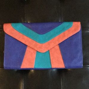Urban Expressions multi-color clutch handbag.